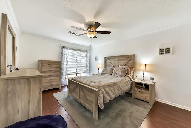 1311 Antoine Dr Unit 110, Houston, TX 77055 - bedroom with dark wood-type flooring, ceiling fan, and ornamental molding