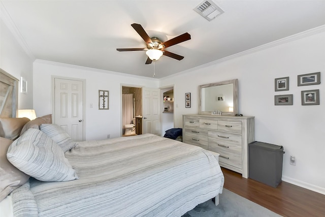 1311 Antoine Dr Unit 110, Houston, TX 77055 - bedroom featuring crown molding, dark wood-type flooring, a ceiling fan, and ensuite bath