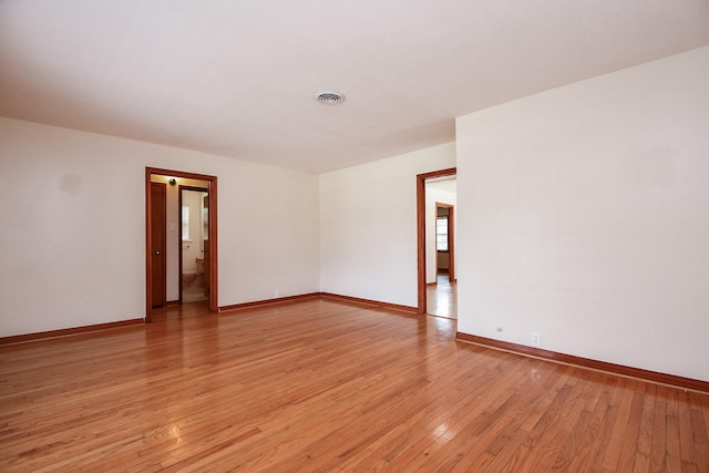 1215 W 31st St, Houston, TX 77018 - spare room featuring light wood finished floors and baseboards