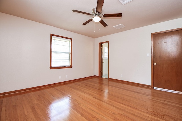 1215 W 31st St, Houston, TX 77018 - empty room with light wood-style flooring and ceiling fan