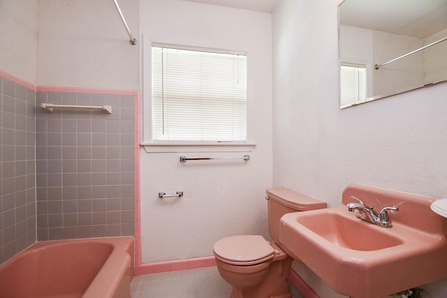 1215 W 31st St, Houston, TX 77018 - bathroom featuring shower / tub combination and tile patterned floors