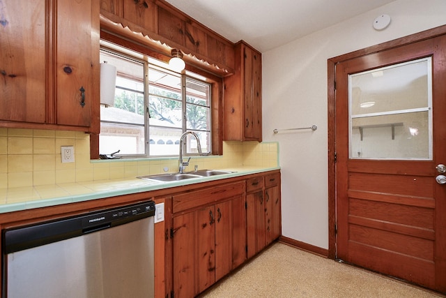 1215 W 31st St, Houston, TX 77018 - kitchen with dishwasher, decorative backsplash, tile counters, and brown cabinetry