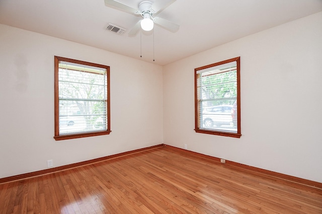 1215 W 31st St, Houston, TX 77018 - unfurnished room featuring light wood-type flooring and a ceiling fan
