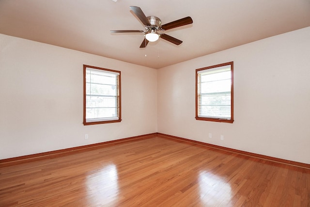 1215 W 31st St, Houston, TX 77018 - empty room with light wood finished floors and a ceiling fan