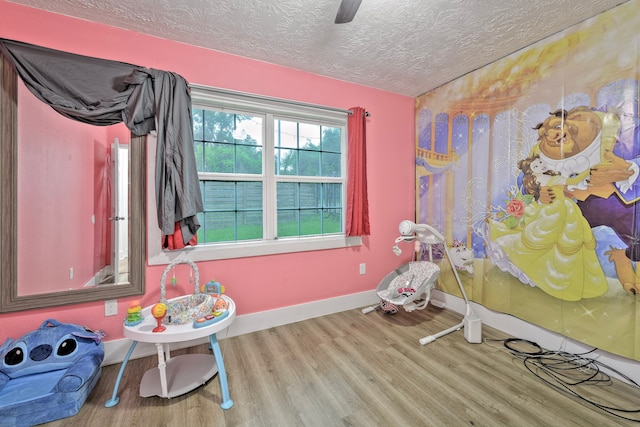 826 Rosewick St, Houston, TX 77015 - recreation room with a textured ceiling and wood finished floors
