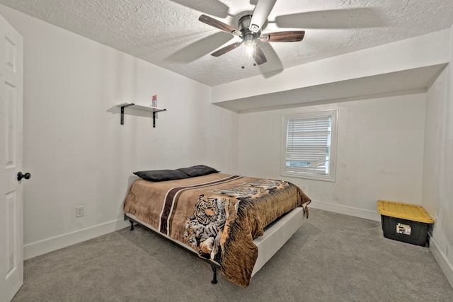 826 Rosewick St, Houston, TX 77015 - bedroom featuring a textured ceiling, carpet flooring, and a ceiling fan