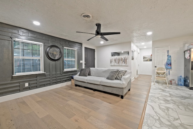 826 Rosewick St, Houston, TX 77015 - living room featuring ceiling fan, a textured ceiling, recessed lighting, and wood finished floors