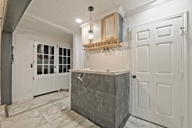 826 Rosewick St, Houston, TX 77015 - bar featuring light marble finish floors, hanging light fixtures, a textured ceiling, and ornamental molding