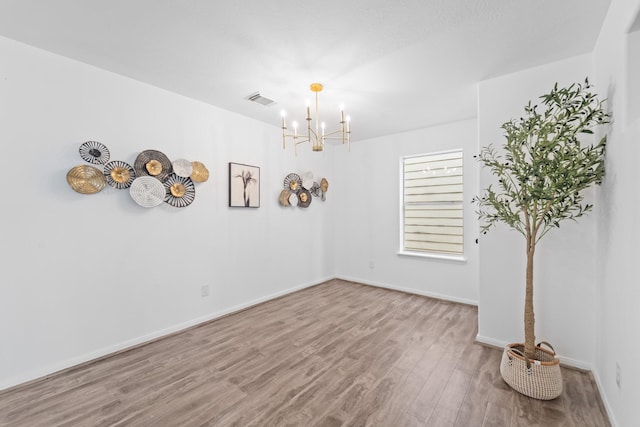 6310 Mountain Pines Ln, Katy, TX 77449 - spare room featuring a chandelier and wood finished floors