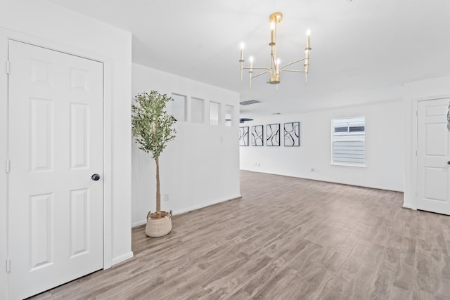 6310 Mountain Pines Ln, Katy, TX 77449 - unfurnished room featuring a chandelier and wood finished floors