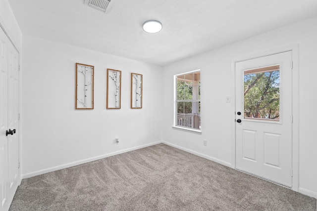 6310 Mountain Pines Ln, Katy, TX 77449 - entryway featuring carpet floors and baseboards
