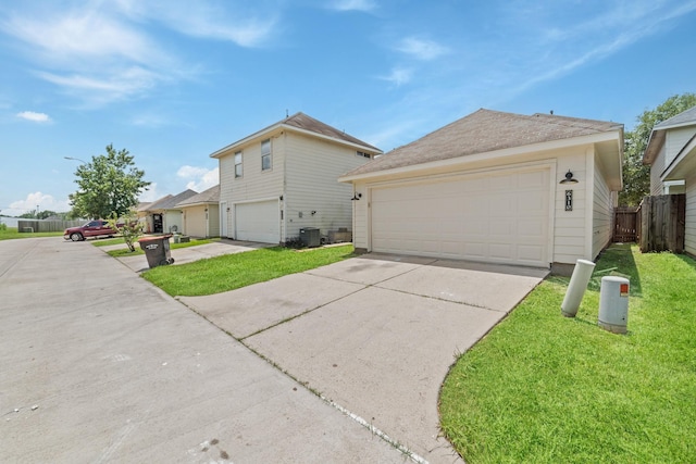 6310 Mountain Pines Ln, Katy, TX 77449 - view of side of home featuring a garage and concrete driveway