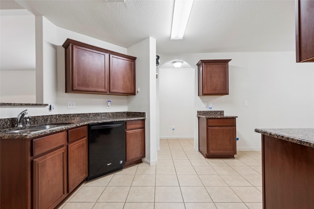 6615 Lost Pines Bnd, Houston, TX 77049 - kitchen featuring black dishwasher, light tile patterned floors, dark stone countertops, and a textured ceiling