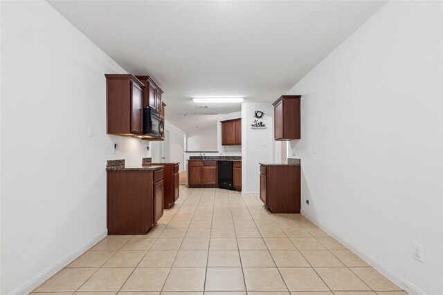 6615 Lost Pines Bnd, Houston, TX 77049 - kitchen with black appliances, light tile patterned floors, vaulted ceiling, and dark stone counters