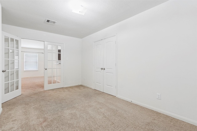 6615 Lost Pines Bnd, Houston, TX 77049 - unfurnished room with french doors and carpet flooring