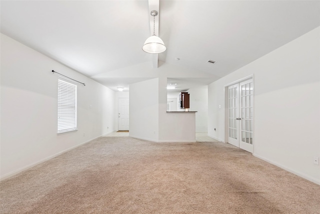 6615 Lost Pines Bnd, Houston, TX 77049 - unfurnished living room with light colored carpet and french doors