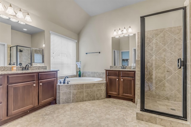 2206 Chelsea Creek Ln, Spring, TX 77386 - bathroom featuring a stall shower, two vanities, tile patterned flooring, a garden tub, and lofted ceiling