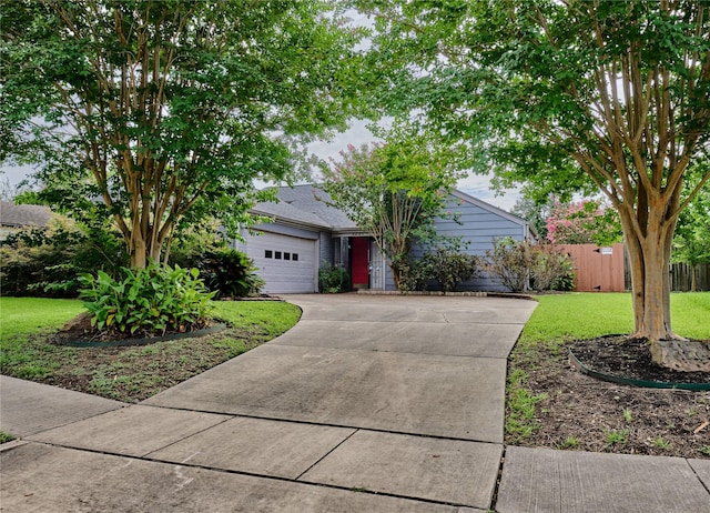 2231 Round Lake Dr, Houston, TX 77077 - view of property hidden behind natural elements with concrete driveway and an attached garage