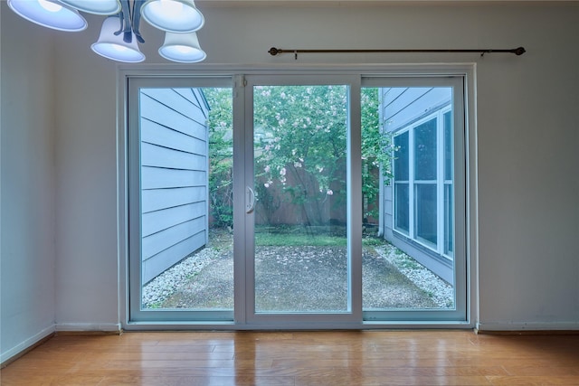2231 Round Lake Dr, Houston, TX 77077 - doorway with a chandelier and wood finished floors