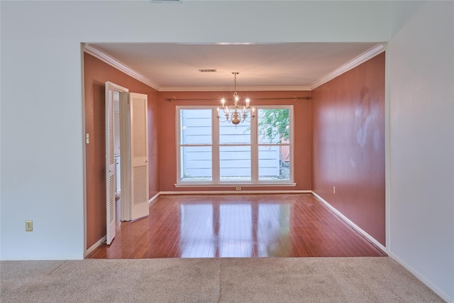 2231 Round Lake Dr, Houston, TX 77077 - unfurnished dining area with a chandelier, carpet flooring, crown molding, and wood finished floors
