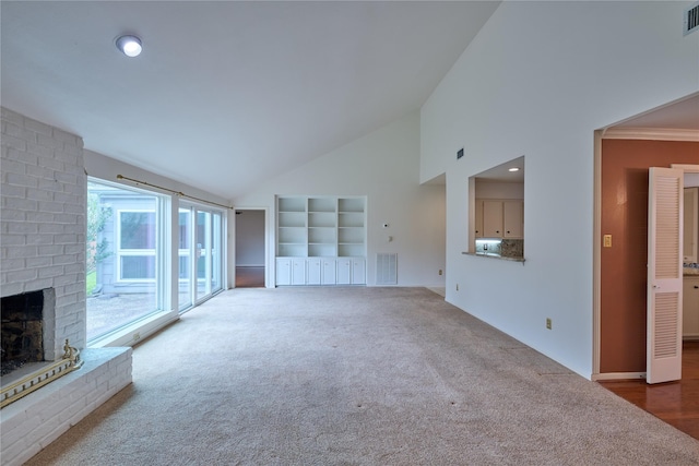 2231 Round Lake Dr, Houston, TX 77077 - unfurnished living room featuring carpet flooring, a brick fireplace, and high vaulted ceiling