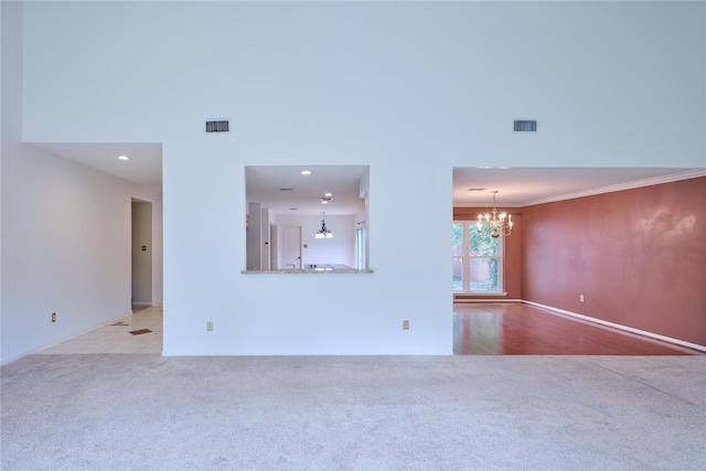 2231 Round Lake Dr, Houston, TX 77077 - unfurnished living room featuring carpet, a chandelier, recessed lighting, and ornamental molding