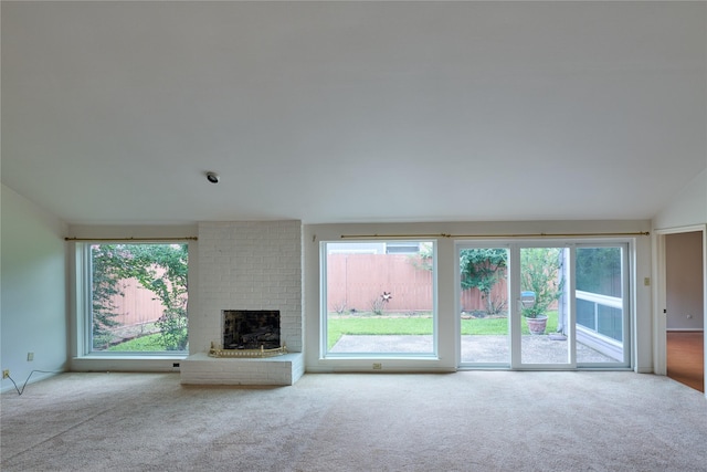 2231 Round Lake Dr, Houston, TX 77077 - unfurnished living room with carpet flooring, plenty of natural light, lofted ceiling, and a fireplace