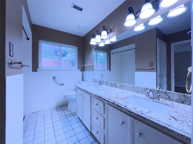2231 Round Lake Dr, Houston, TX 77077 - full bath featuring tile walls, tile patterned flooring, and double vanity