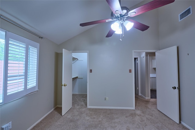 2231 Round Lake Dr, Houston, TX 77077 - unfurnished bedroom with carpet, a walk in closet, high vaulted ceiling, and ceiling fan