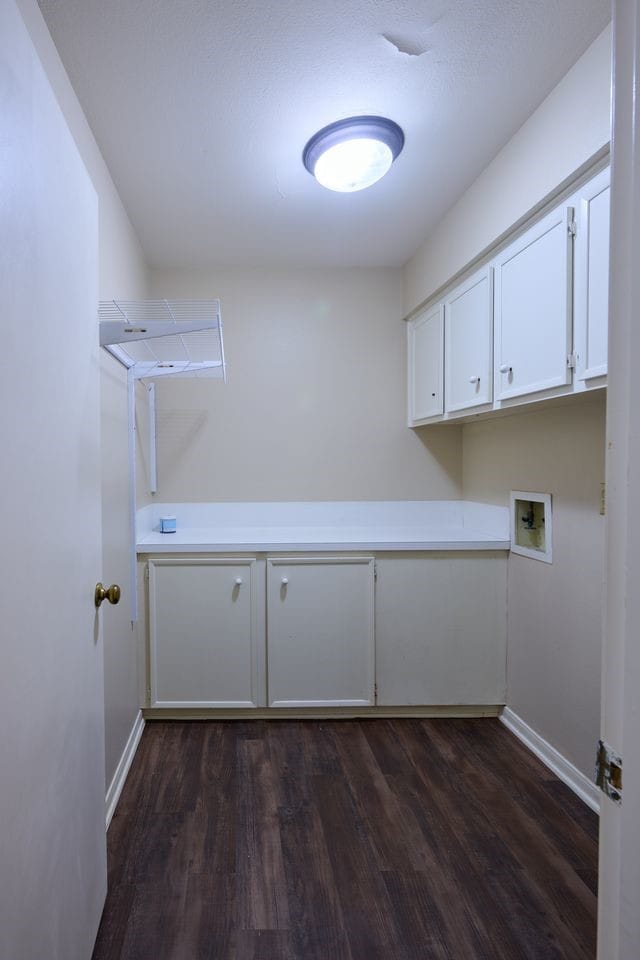 2231 Round Lake Dr, Houston, TX 77077 - laundry room featuring cabinet space, hookup for a washing machine, and dark wood-style floors