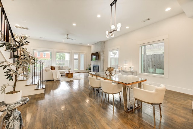 1919 Rosewood St, Houston, TX 77004 - dining room featuring wood finished floors, recessed lighting, stairway, a ceiling fan, and a large fireplace
