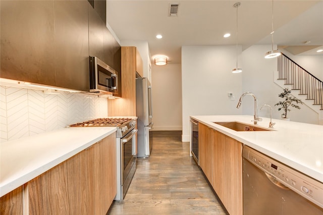 1919 Rosewood St, Houston, TX 77004 - kitchen featuring stainless steel appliances, modern cabinets, light countertops, and recessed lighting