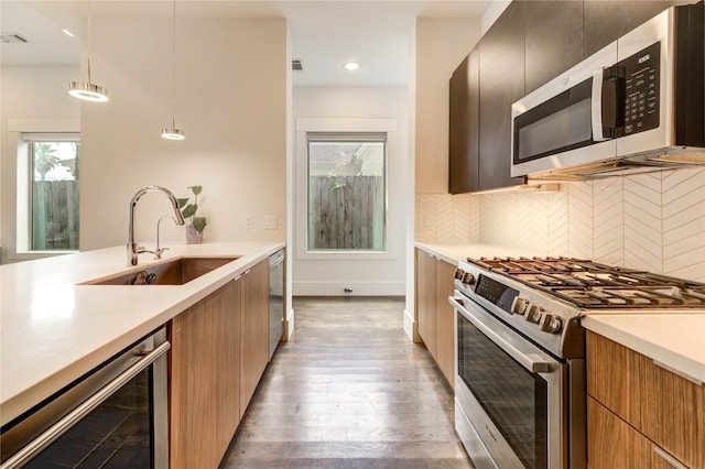 1919 Rosewood St, Houston, TX 77004 - kitchen featuring stainless steel appliances, wine cooler, modern cabinets, light countertops, and recessed lighting