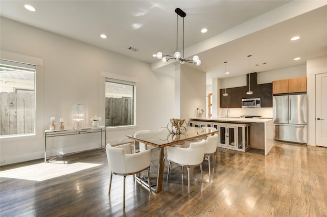 1919 Rosewood St, Houston, TX 77004 - dining space featuring wood finished floors, recessed lighting, and a chandelier