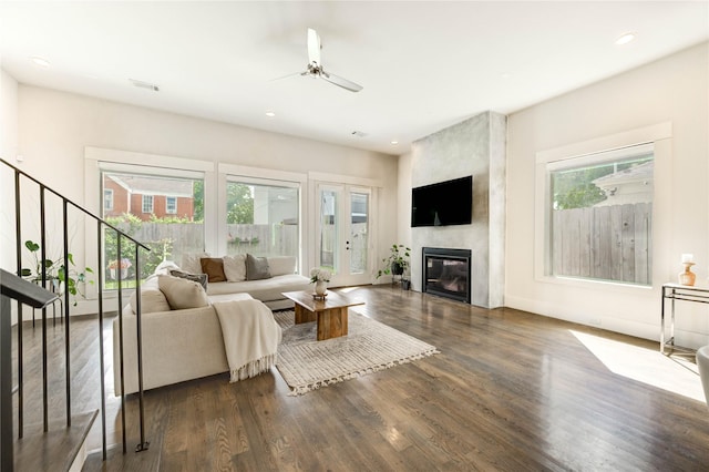 1919 Rosewood St, Houston, TX 77004 - living area featuring wood finished floors, ceiling fan, a fireplace, stairs, and recessed lighting