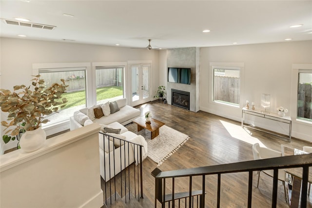 1919 Rosewood St, Houston, TX 77004 - living room featuring healthy amount of natural light, a fireplace, wood finished floors, recessed lighting, and ceiling fan