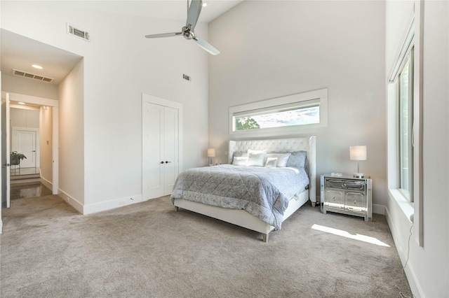 1919 Rosewood St, Houston, TX 77004 - bedroom featuring a high ceiling, carpet flooring, ceiling fan, and a closet