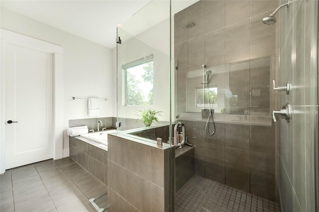 1919 Rosewood St, Houston, TX 77004 - full bath with tile patterned floors, a stall shower, and a garden tub