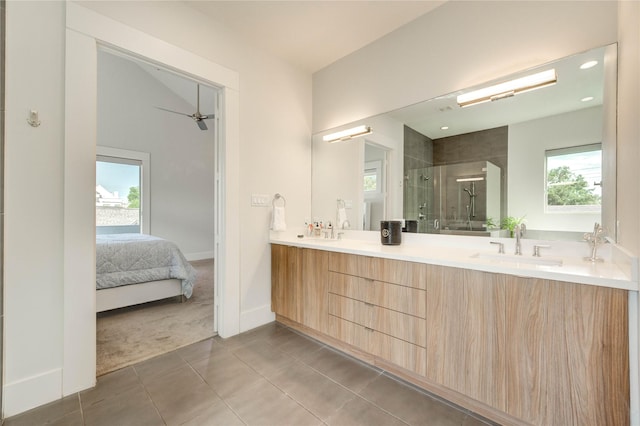 1919 Rosewood St, Houston, TX 77004 - ensuite bathroom with a shower stall, double vanity, tile patterned floors, and a ceiling fan