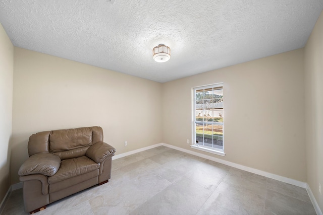 21627 Cimarron Pkwy, Katy, TX 77450 - unfurnished room with baseboards and a textured ceiling