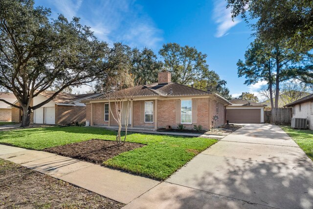 21627 Cimarron Pkwy, Katy, TX 77450 - ranch-style house with brick siding and a chimney