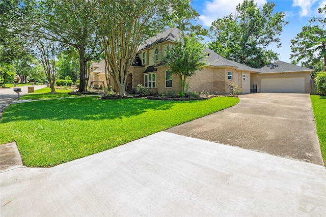 2318 Pleasant Crk, Houston, TX 77345 - view of front of home with driveway, a garage, a front lawn, and brick siding