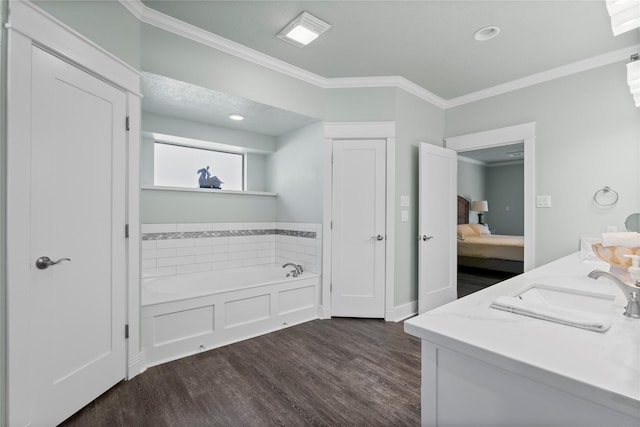 2318 Pleasant Crk, Houston, TX 77345 - ensuite bathroom featuring crown molding, a bath, wood finished floors, and double vanity