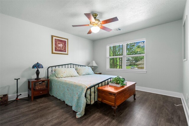 2318 Pleasant Crk, Houston, TX 77345 - bedroom featuring wood finished floors, a textured ceiling, and a ceiling fan