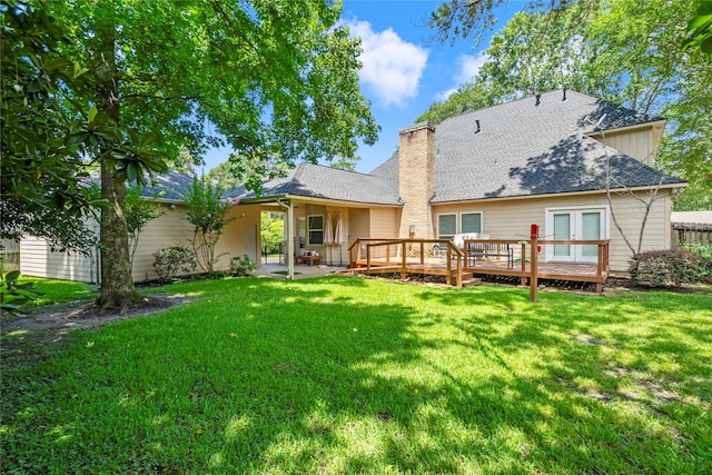 2318 Pleasant Crk, Houston, TX 77345 - back of property featuring a wooden deck, a lawn, a chimney, roof with shingles, and french doors