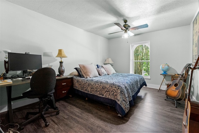 2318 Pleasant Crk, Houston, TX 77345 - bedroom featuring dark wood finished floors, an office area, a textured ceiling, and ceiling fan