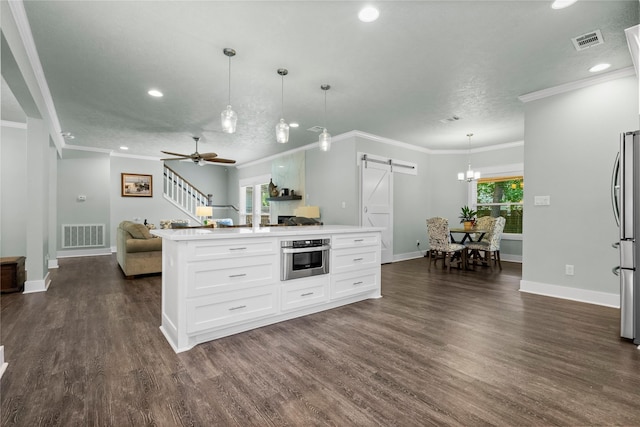 2318 Pleasant Crk, Houston, TX 77345 - kitchen featuring a barn door, stainless steel appliances, open floor plan, dark wood-style floors, and recessed lighting