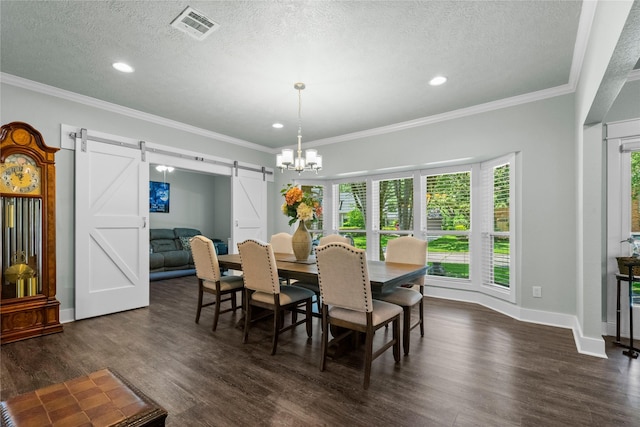 2318 Pleasant Crk, Houston, TX 77345 - dining room featuring a barn door, dark wood-style flooring, a textured ceiling, recessed lighting, and a chandelier