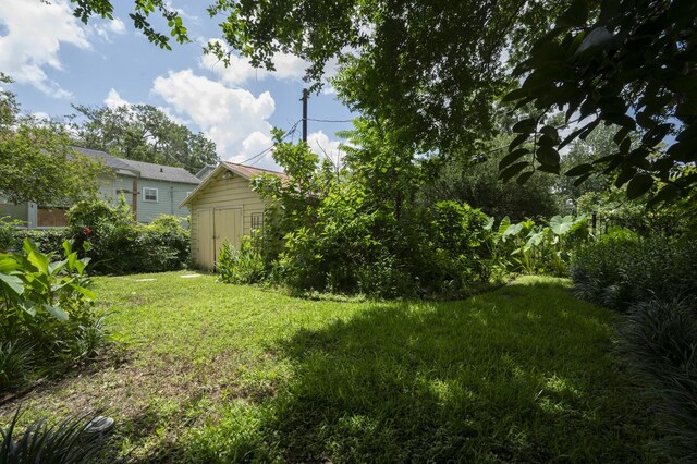 618 Wendel St, Houston, TX 77009 - view of green lawn with a storage shed