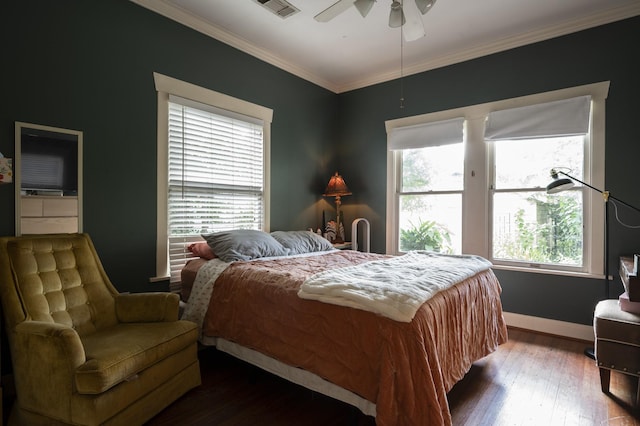 618 Wendel St, Houston, TX 77009 - bedroom featuring ornamental molding, dark wood-type flooring, and ceiling fan